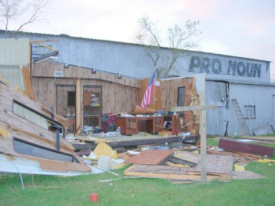 The aftermath of Rita. This office had its roof and walls ripped off by the hurricane, but the Stars and Stripes withstood the winds. Photo: Arved Plaks - pics/2006/12313_1.jpg