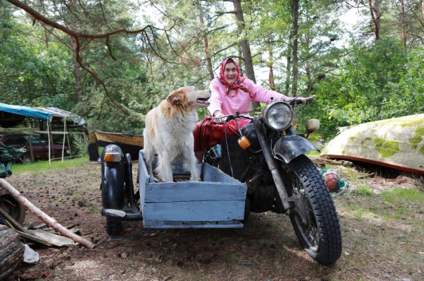 The Estonian island of Kihnu is run by women. Virve Koster, 91, above, better known as “Kihnu Virve,” is one of Estonia’s top-selling female folk singers. Here, she takes a spin on a vintage Soviet motorcycle with her dog, Ketu, in the side car. Birgit Puve for The New York Times - pics/2019/10/54532_001_t.jpg